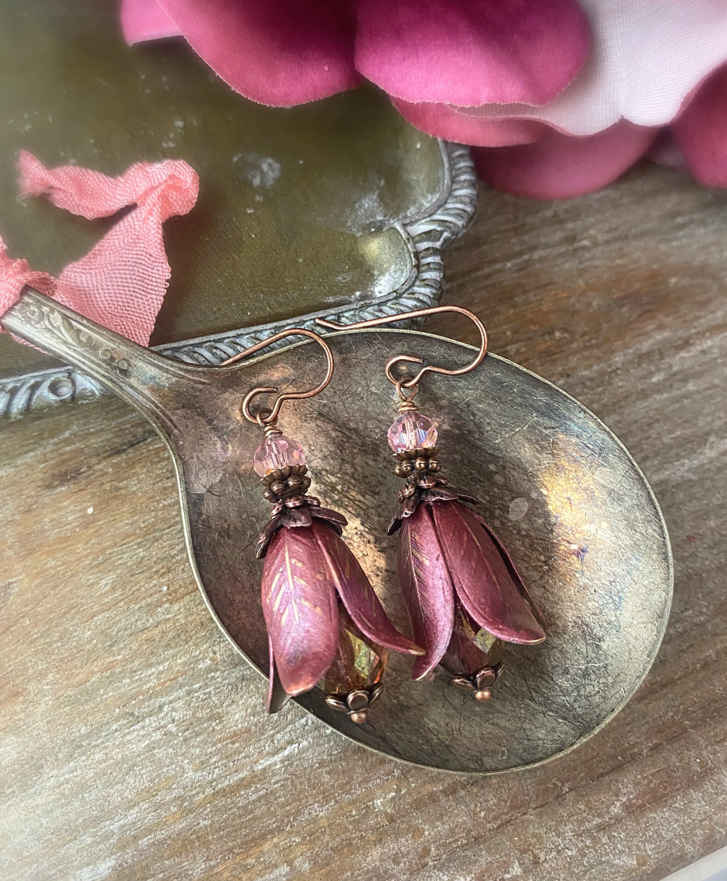 Rose pink polish glass, Vintaj flower bead caps, pink crystal, and copper metal earrings.